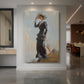 Canvas art print of an impressionist scene of a woman standing outdoors on a hill in soft light displayed as a statement piece in a spacious interior.