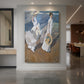 Canvas art print of an impressionist beach scene of women walking along the shore in bright light displayed as a statement piece in a spacious interior.
