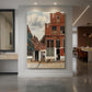 Canvas art print of a Baroque street scene of brick houses and figures in a quiet town setting displayed as a statement piece in a spacious interior.