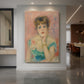Canvas art print of an impressionist portrait of an actress with bright tones and lively expression displayed as a statement piece in a spacious interior.