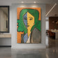 Canvas art print of a modern portrait of a woman with bold color blocks and simplified features displayed as a statement piece in a spacious interior.