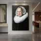 Canvas art print of a Baroque portrait of a woman in dark attire with soft warm light displayed as a statement piece in a spacious interior.