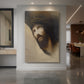 Canvas art print of a symbolic portrait of a figure with bowed head in soft, glowing light displayed as a statement piece in a spacious interior.