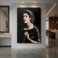 Canvas art print of a dramatic portrait of a woman with intense expression and dark background displayed as a statement piece in a spacious interior.