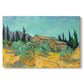 Canvas art print portraying rustic sheds surrounded by olive trees and tall cypresses in rural landscape, set against a white background