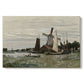 Canvas art print portraying a single windmill beside water with surrounding buildings and sky, set against a white background