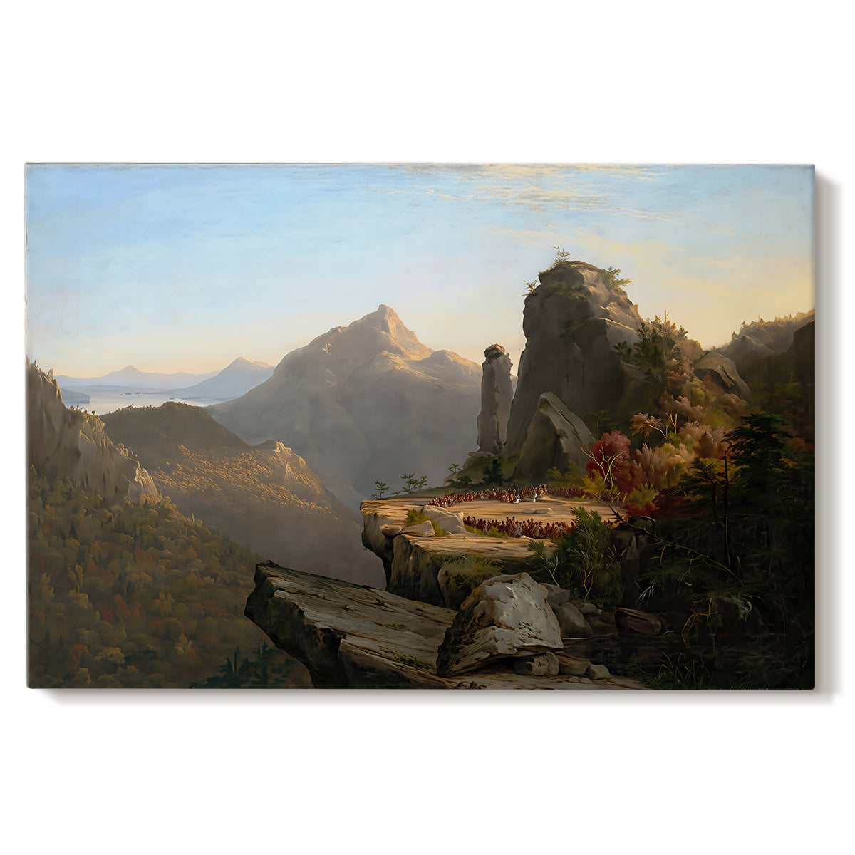 Canvas art print portraying a rugged mountain landscape with small figures near water and rocky cliffs, set against a white background