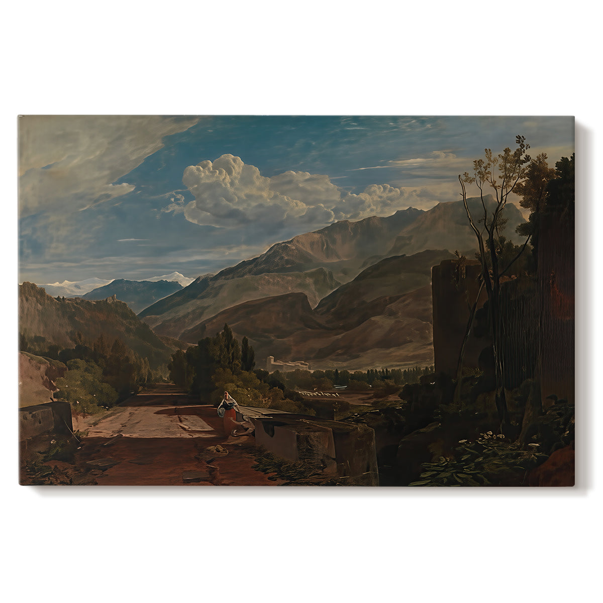 Canvas art print portraying a mountain landscape with town and river under dramatic sky, set against a white background