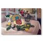 Canvas art print portraying a tabletop still life with pineapple, lemons, and fruit, set against a white background