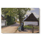 Canvas art print portraying a woman and milkman standing along village street with houses nearby, set against a white background