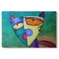 Canvas art print portraying a colorful geometric cat face with angular shapes, set against a white background