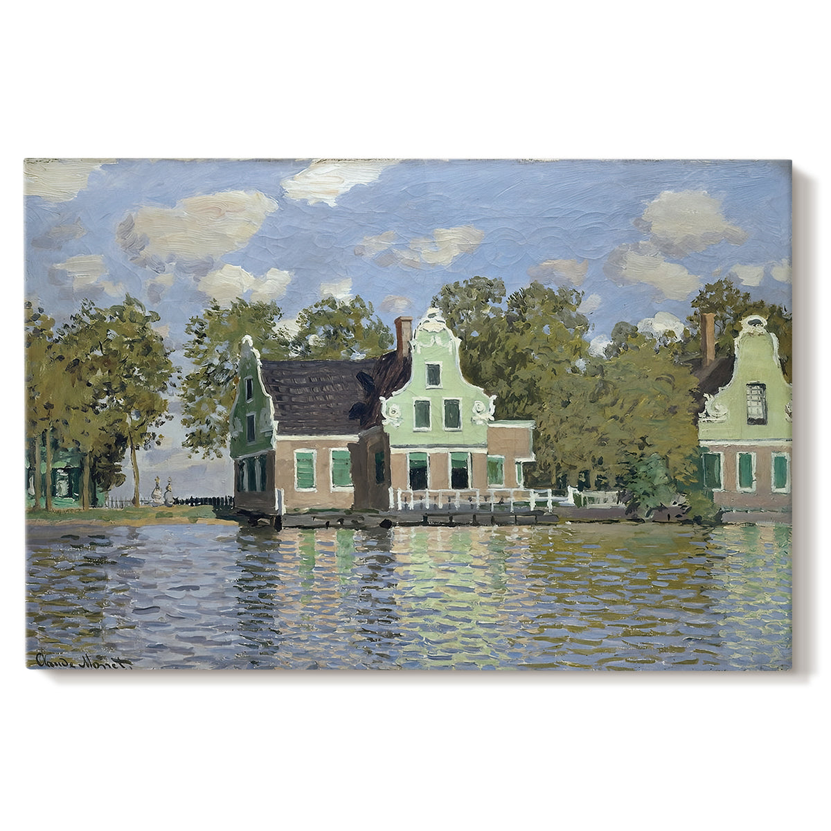 Canvas art print portraying a row of houses along river with reflections in calm water, set against a white background