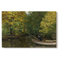 Canvas art print portraying a young boy fishing beside calm water surrounded by greenery, set against a white background
