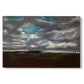 Canvas art print portraying a wide landscape beneath heavy grey clouds, set against a white background