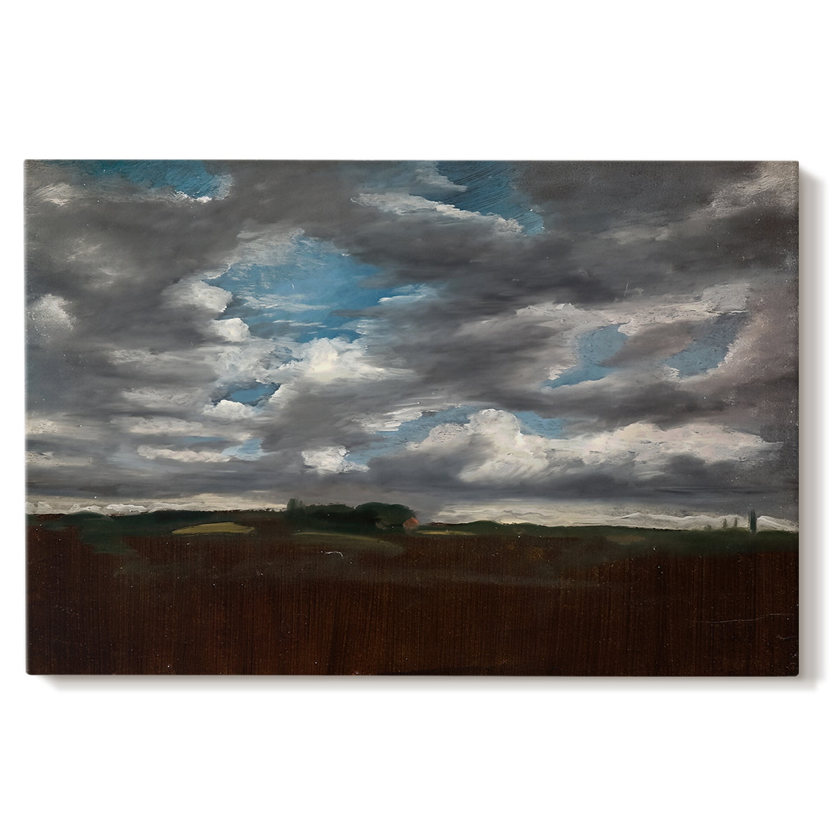 Canvas art print portraying a wide landscape beneath heavy grey clouds, set against a white background
