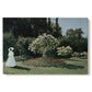 Canvas art print portraying a woman standing in garden surrounded by flowers and greenery, set against a white background