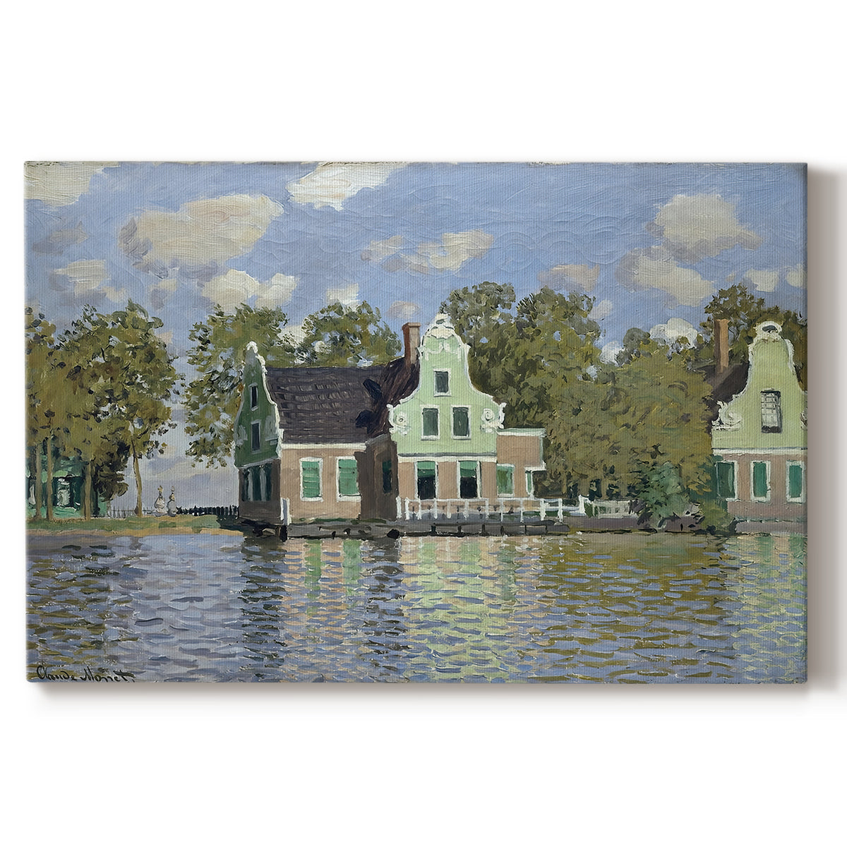 Canvas art print portraying a row of houses along river with reflections in calm water, set against a white background