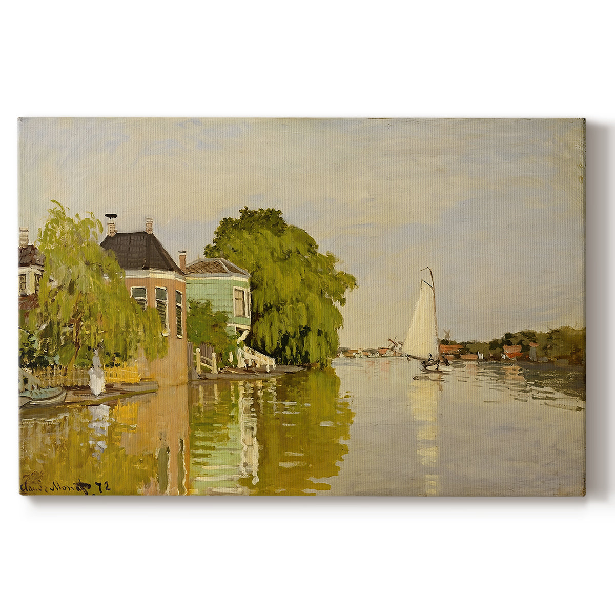Canvas art print portraying colorful houses reflected in calm river surrounded by greenery, set against a white background