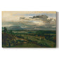 Canvas art print portraying a town set within landscape with cliffs and surrounding countryside, set against a white background