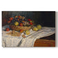 Canvas art print portraying an arrangement of apples and grapes on table with soft natural light, set against a white background