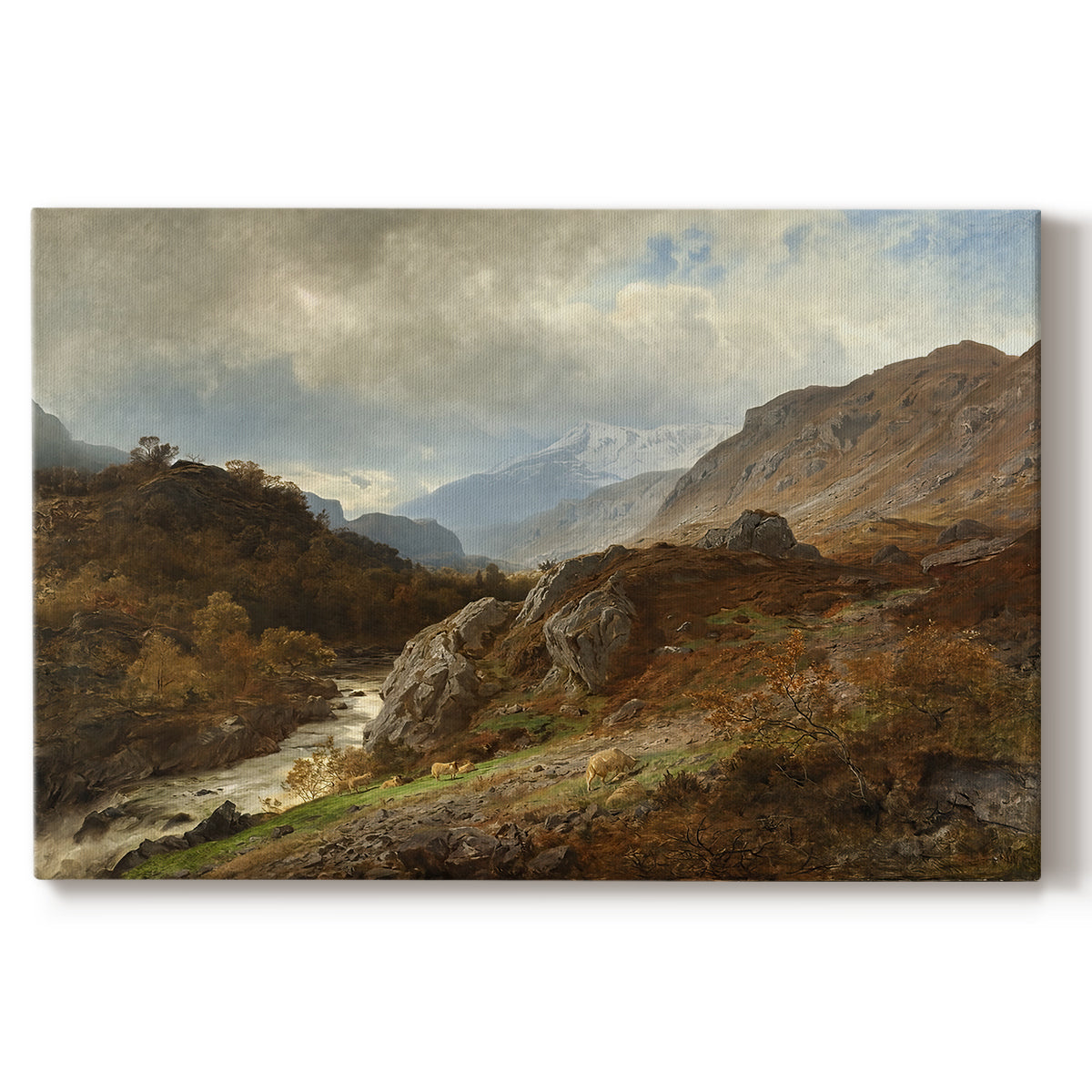 Canvas art print portraying a rugged mountain terrain with valley and distant peaks under open sky, set against a white background