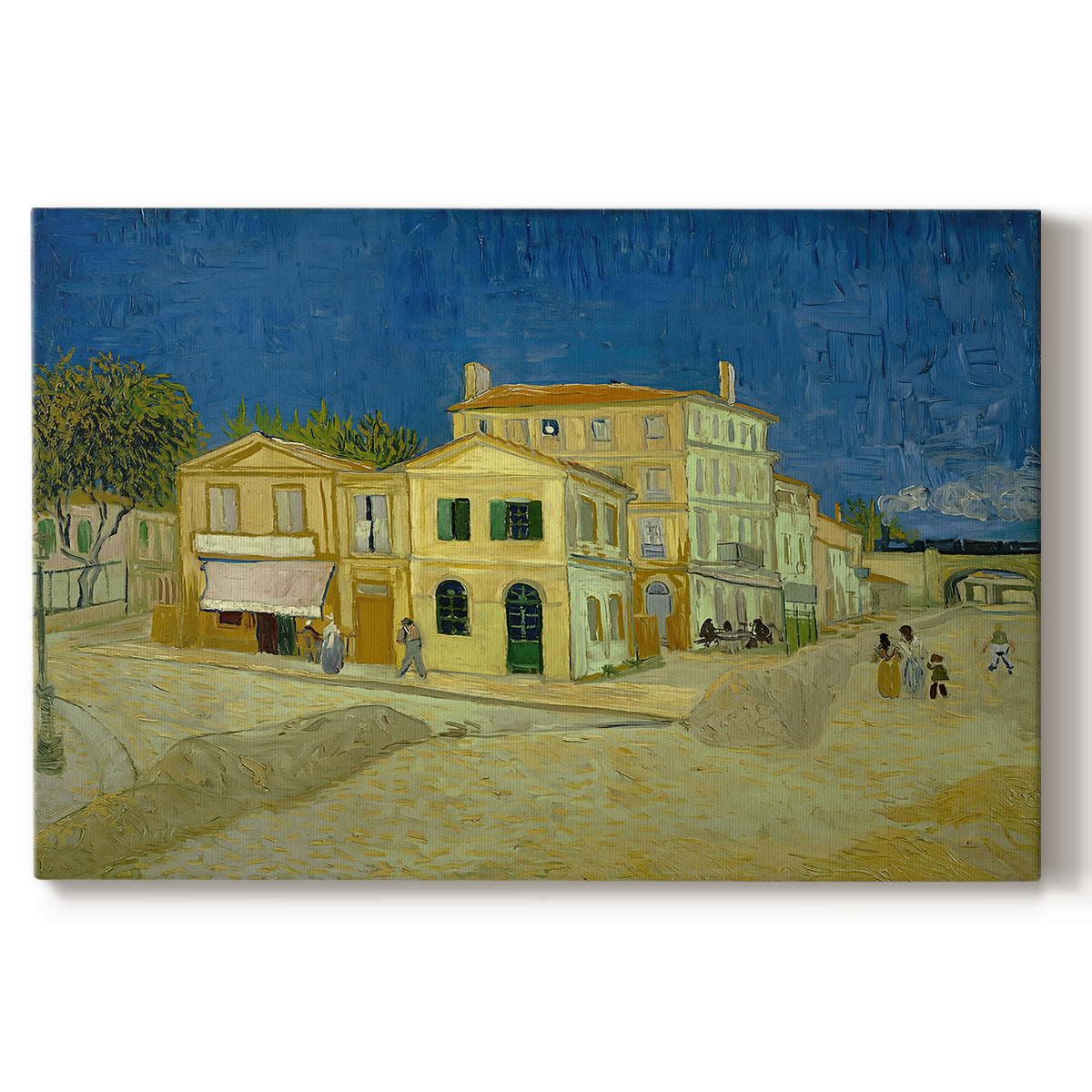 Canvas art print portraying a street view with bright yellow house and neighboring buildings under blue sky, set against a white background
