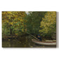 Canvas art print portraying a young boy fishing beside calm water surrounded by greenery, set against a white background