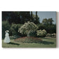 Canvas art print portraying a woman standing in garden surrounded by flowers and greenery, set against a white background
