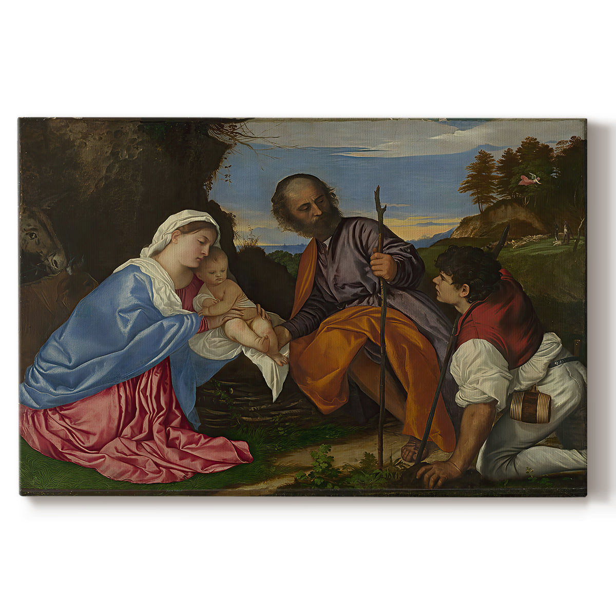 Canvas art print portraying a holy family gathered with shepherd in rustic outdoor setting, set against a white background