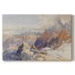 Canvas art print portraying a mountain pass with snow-covered peaks and expansive alpine valley, set against a white background