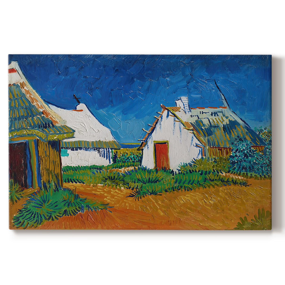 Canvas art print portraying white cottages grouped together with bold colors and surrounding landscape, set against a white background