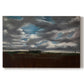 Canvas art print portraying a wide landscape beneath heavy grey clouds, set against a white background