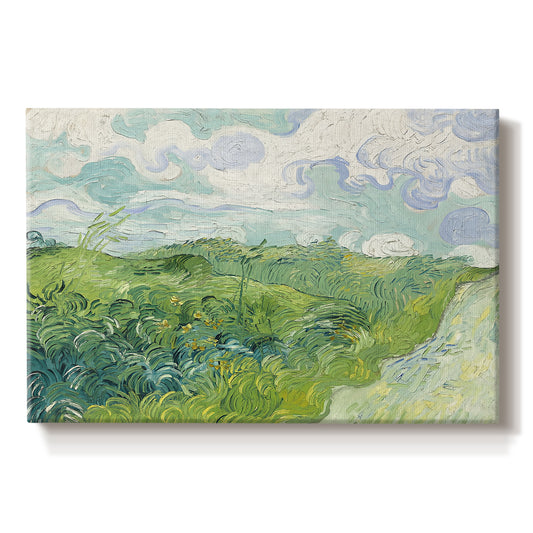 Canvas art print portraying a vivid green wheat field stretching across rolling landscape under pale sky, set against a white background