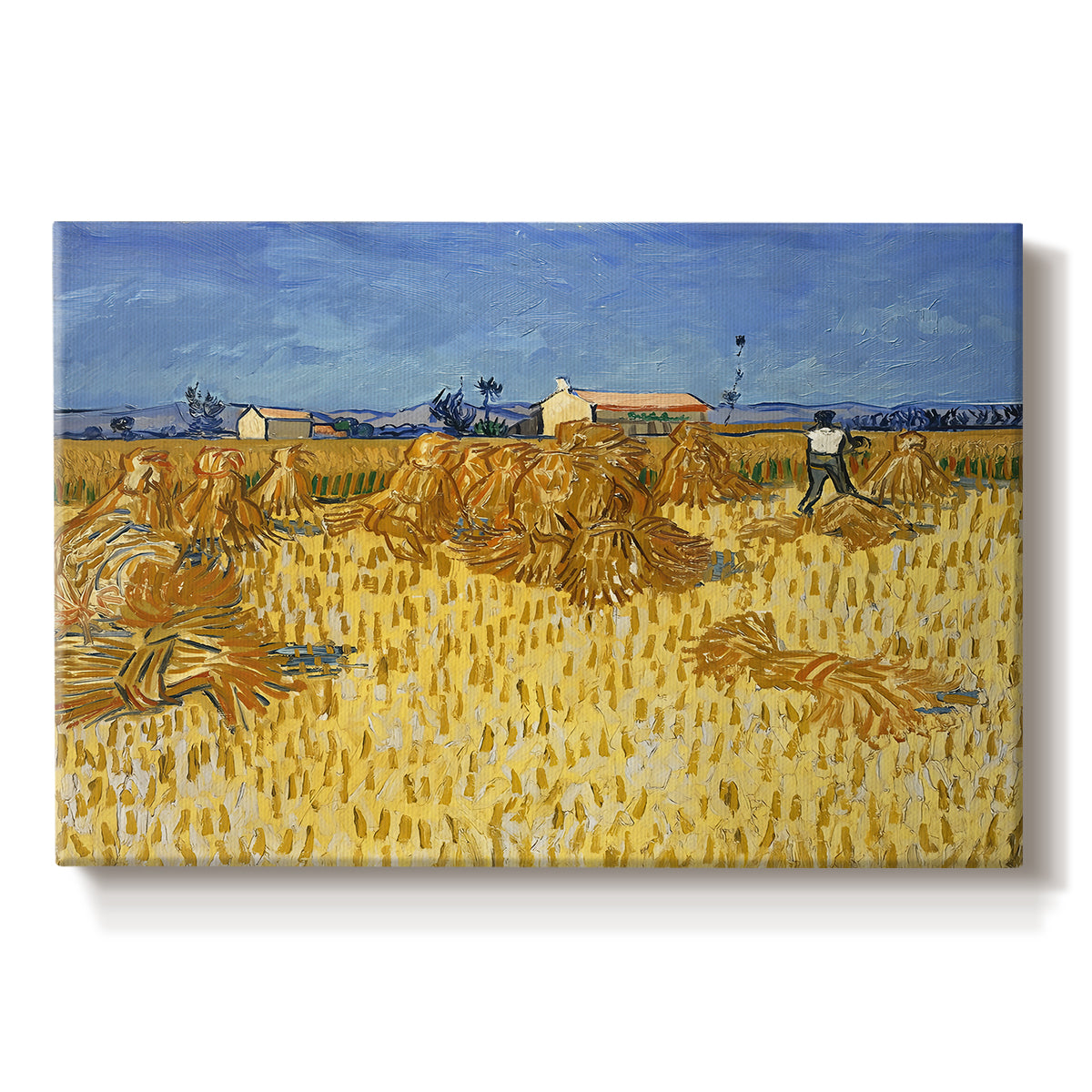 Canvas art print portraying stacked bundles of wheat arranged across harvested field under open sky, set against a white background