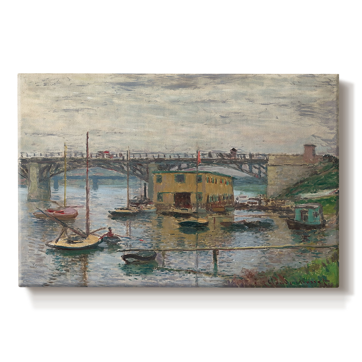 Canvas art print portraying a bridge crossing river under gray sky with muted reflections, set against a white background