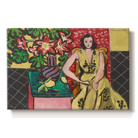 Canvas art print portraying a seated woman beside a vase of amaryllis in a richly patterned interior, set against a white background