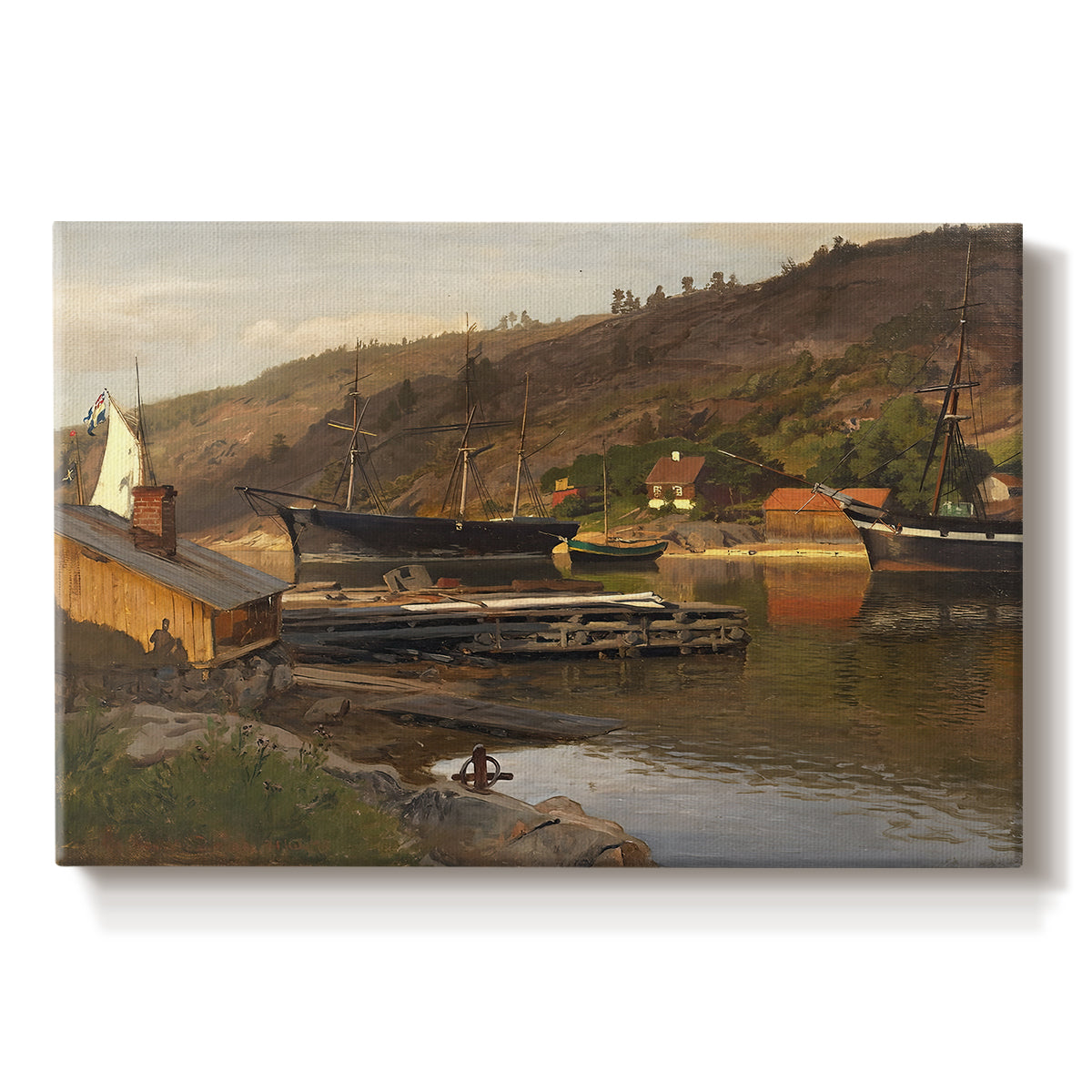 Canvas art print portraying a small harbor with boats docked along shoreline near buildings, set against a white background