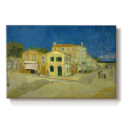 Canvas art print portraying a street view with bright yellow house and neighboring buildings under blue sky, set against a white background