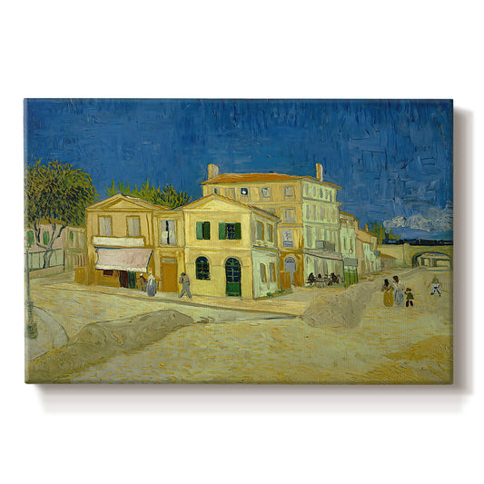 Canvas art print portraying a street view with bright yellow house and neighboring buildings under blue sky, set against a white background