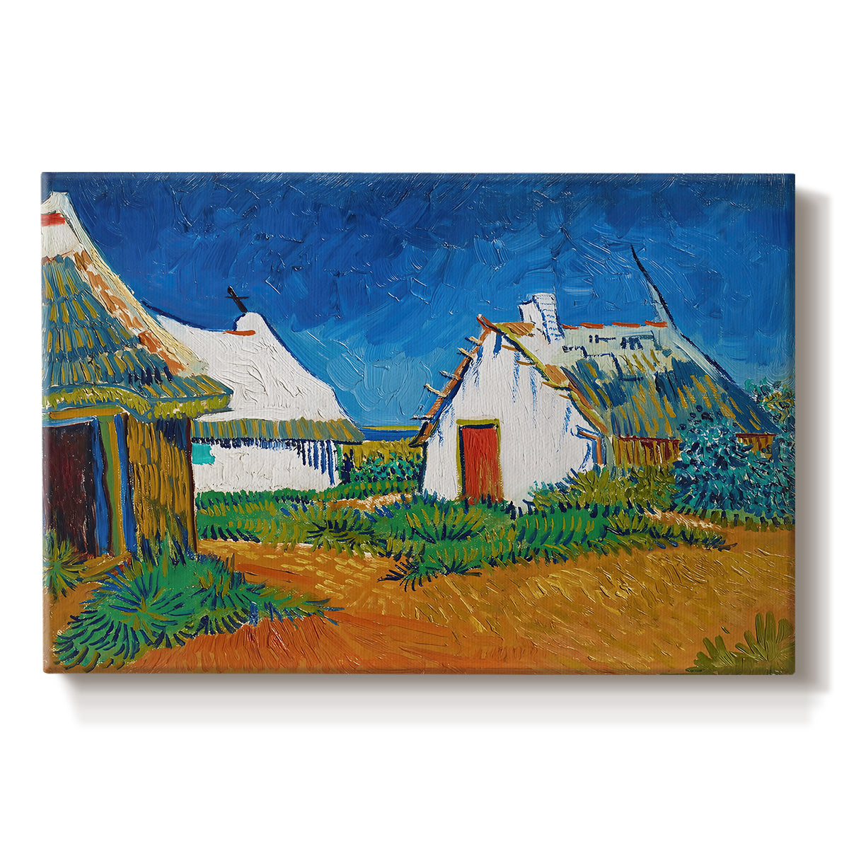 Canvas art print portraying white cottages grouped together with bold colors and surrounding landscape, set against a white background
