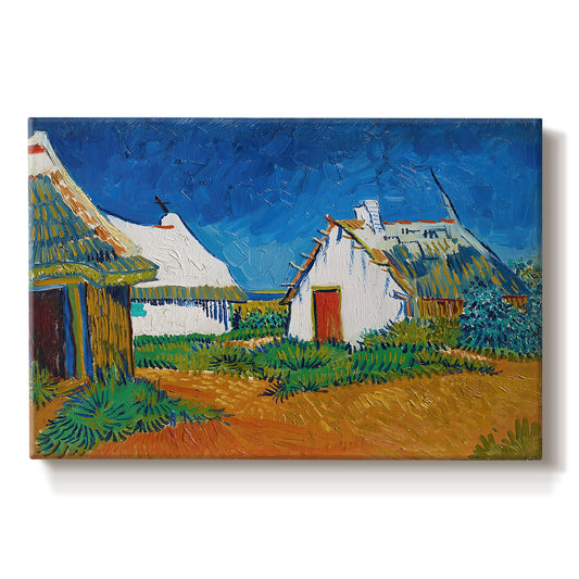 Canvas art print portraying white cottages grouped together with bold colors and surrounding landscape, set against a white background