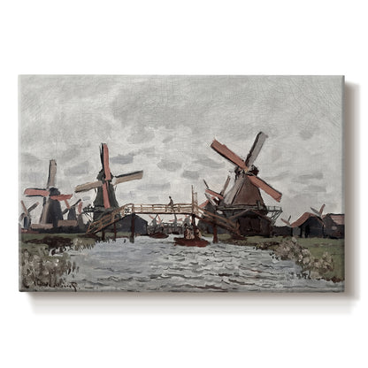 Canvas art print portraying windmills standing beside water under open sky in rural landscape, set against a white background