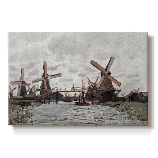 Canvas art print portraying windmills standing beside water under open sky in rural landscape, set against a white background