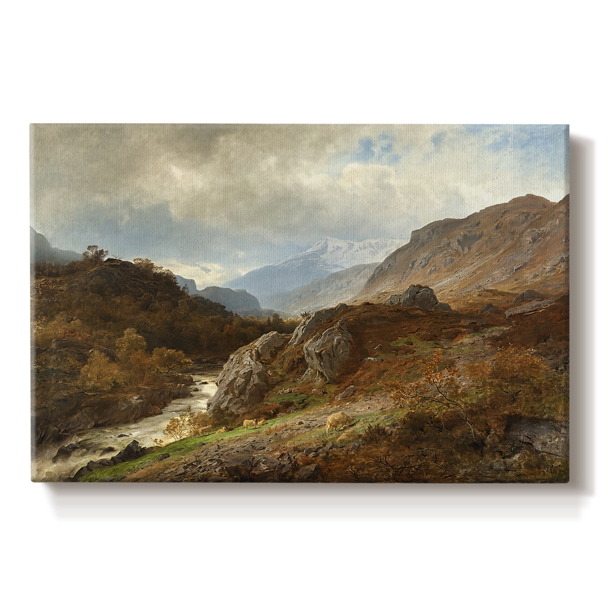 Canvas art print portraying a rugged mountain terrain with valley and distant peaks under open sky, set against a white background