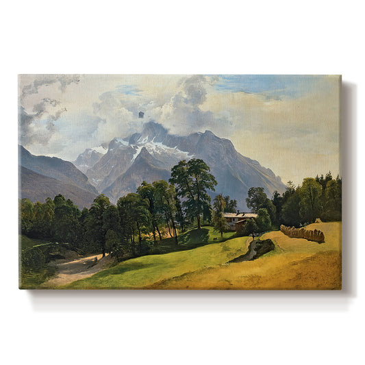 Canvas art print portraying an alpine mountain landscape with towering peaks and valley below, set against a white background