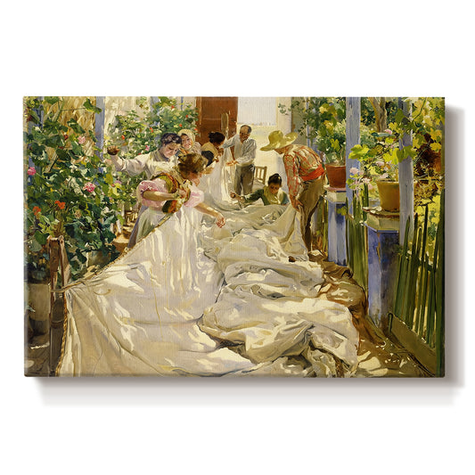 Canvas art print portraying figures working together sewing large sail outdoors in bright light, set against a white background