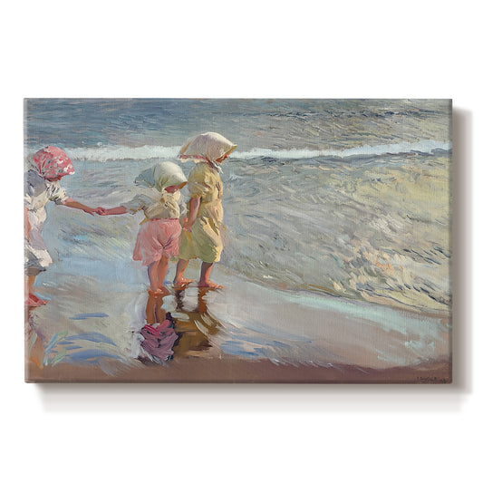 Canvas art print portraying three women standing together on beach in flowing dresses, set against a white background