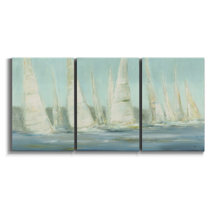 Three-panel canvas wall art featuring sailboats silhouetted at sunrise on white background.