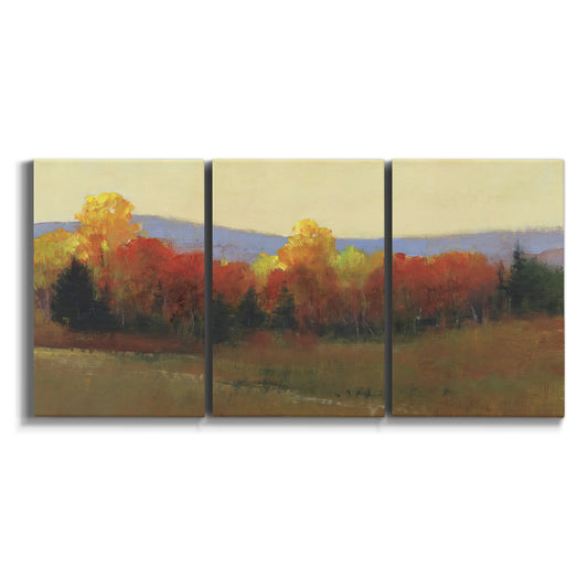 Three-panel canvas wall art featuring autumn landscape changing foliage on white background.