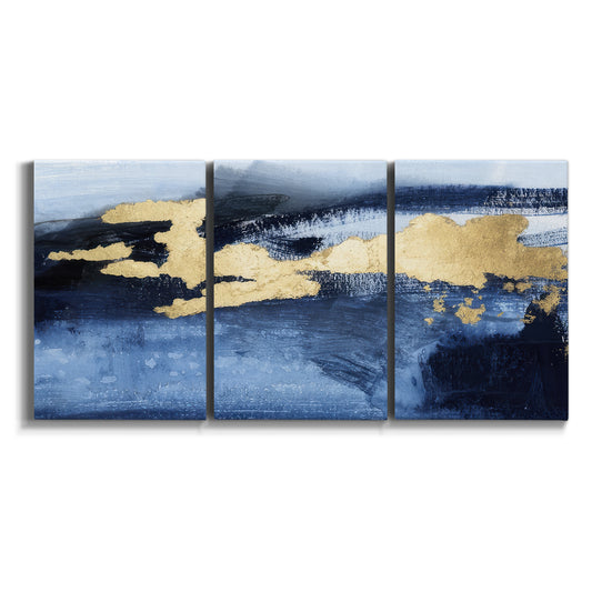 Three-panel canvas wall art featuring coastal shoreline with warm light on white background.
